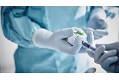 Biogel glove holding a trocar